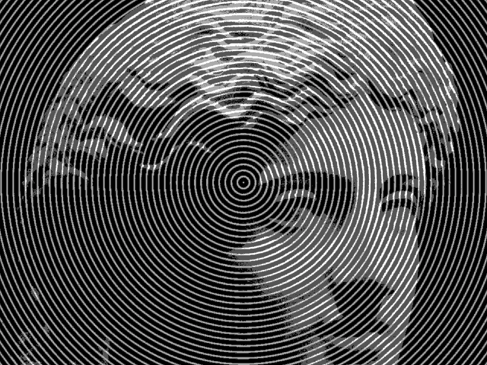 FREQ 10: tight concentric banding, the subject reading through it